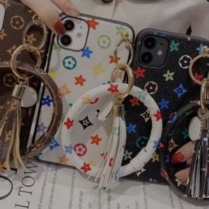 Multiple brand new never been used IPhone cases with puppy 🐕 dog key chain